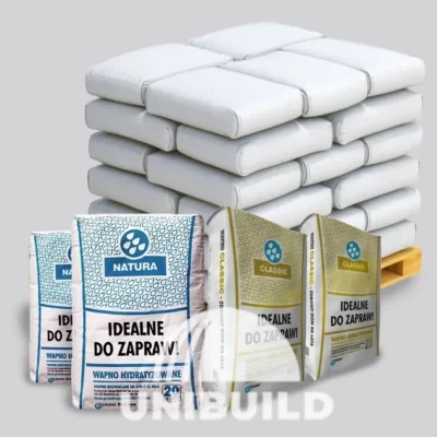 Unibuild hempcrete material supply with natural lime bags and bulk bagged materials on a pallet.
